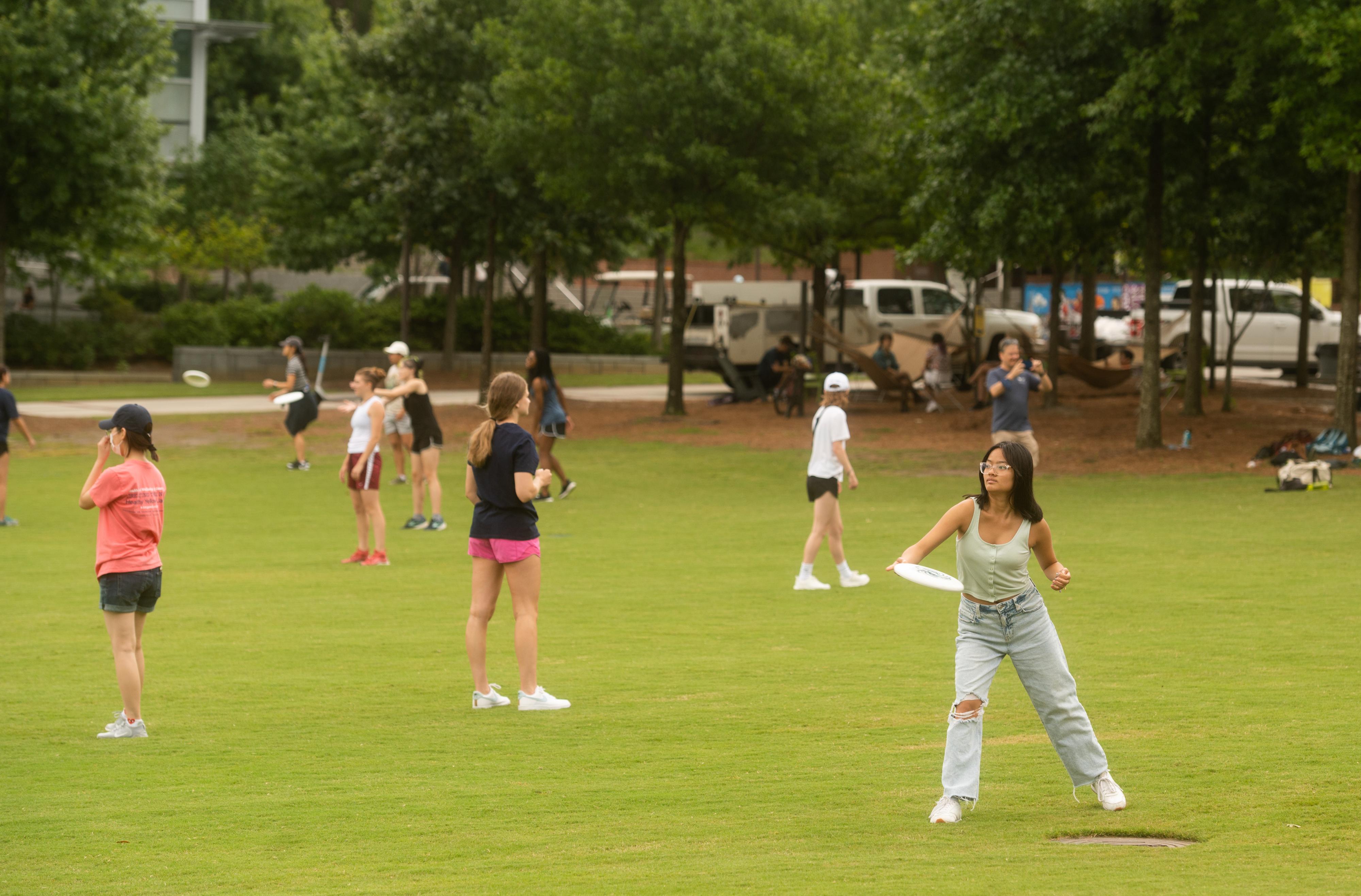 Georgia Tech students playing frisbee outside