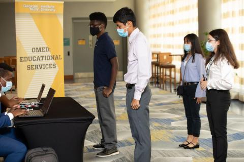 Student participants check in on opening day