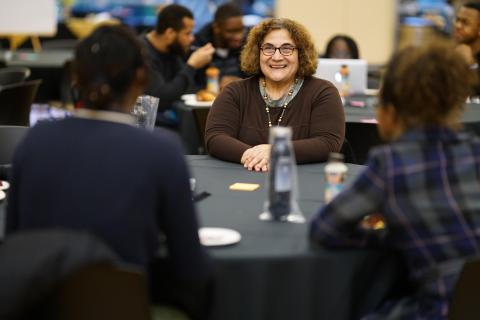 Participants engage at the faculty seminar and dinner