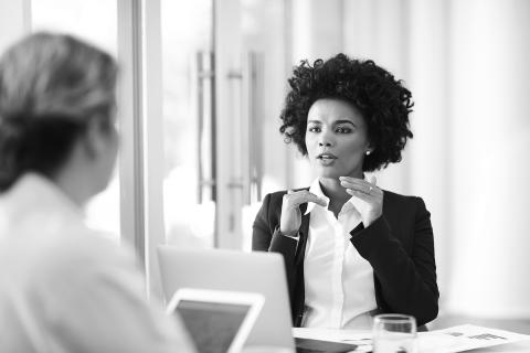 Woman talking with co-worker.